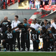 Jacksonville Jaguar players protest during the national anthem at the NFL International Series match between the Baltimore Ravens and the Jaguars at Wembley Stadium on Sept. 24, 2017, in London.